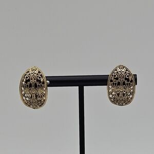 gold tone filigree curved clip on earrings